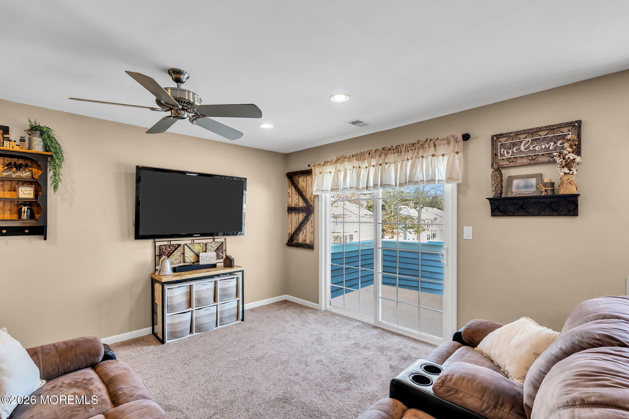 402 Brookview Court Howell, NJ 07731 - Photo 11 of 22 a living room with furniture and a flat screen tv