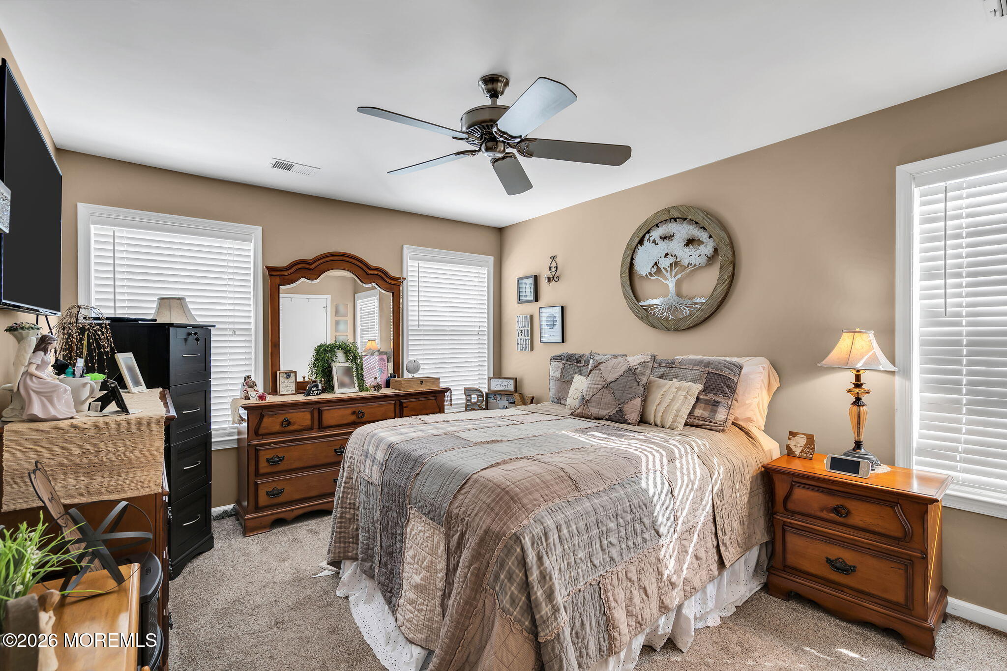 402 Brookview Court Howell, NJ 07731 - Photo 14 of 22 a bedroom with a bed a large window and a chandelier