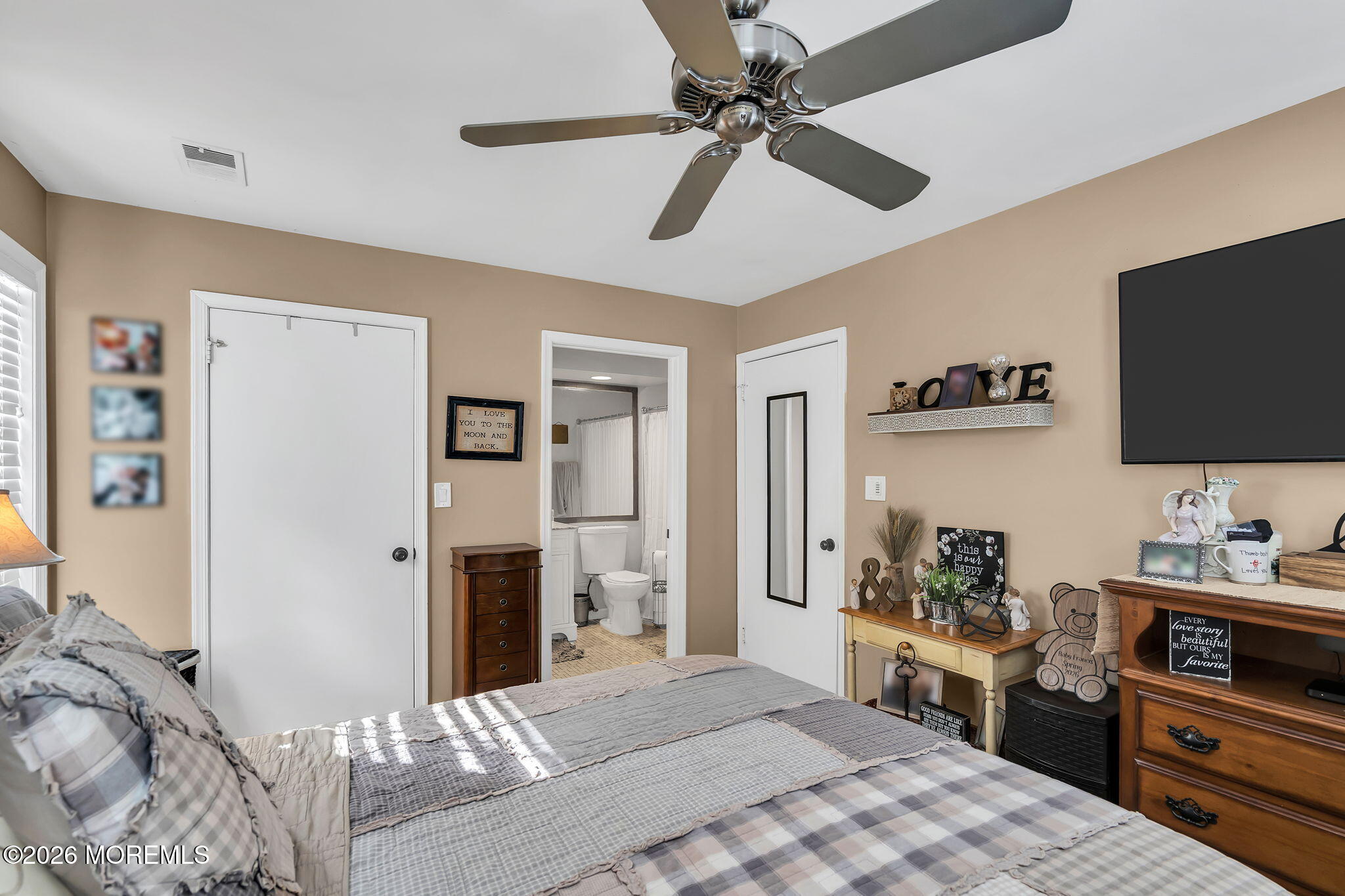 402 Brookview Court Howell, NJ 07731 - Photo 15 of 22 a bedroom with a bed and a flat screen tv