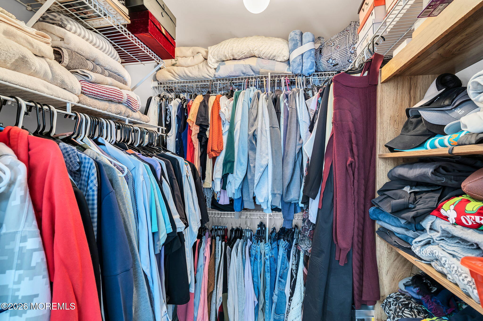 402 Brookview Court Howell, NJ 07731 - Photo 16 of 22 a view of walk in closet with clothes and shoes