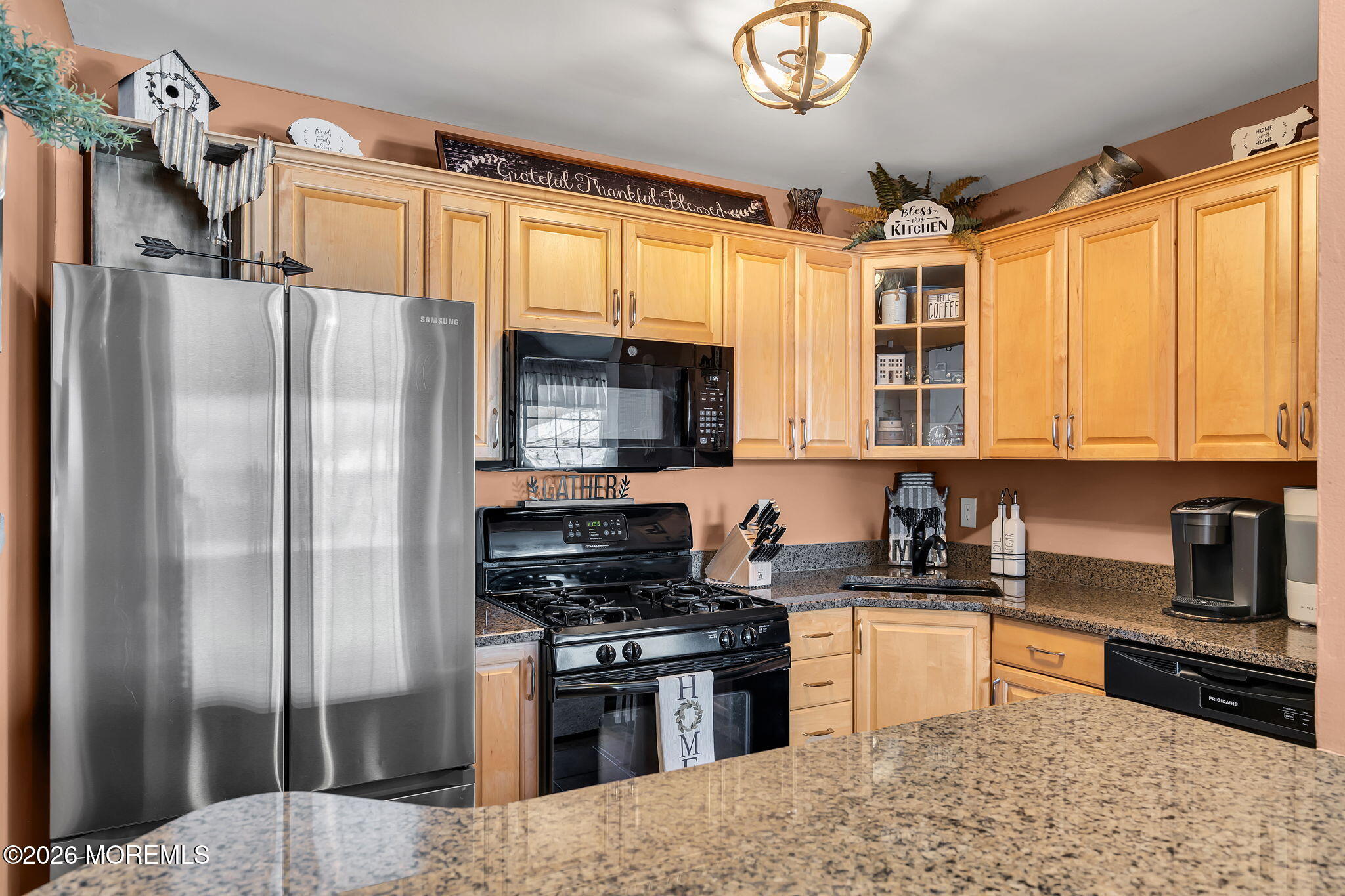 402 Brookview Court Howell, NJ 07731 - Photo 6 of 22 a kitchen with stainless steel appliances granite countertop a refrigerator a stove a sink and a microwave