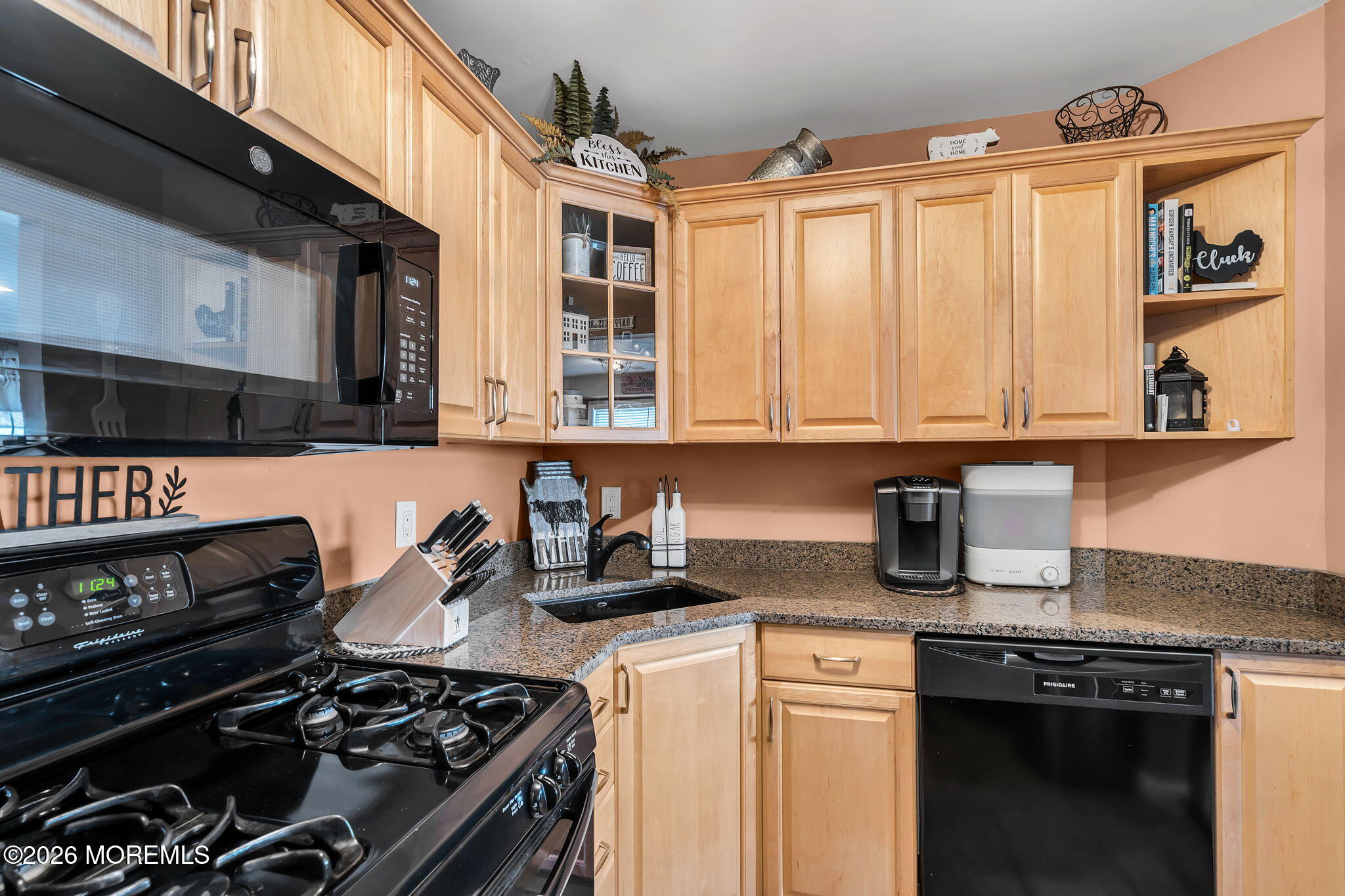 402 Brookview Court Howell, NJ 07731 - Photo 7 of 22 a kitchen with stainless steel appliances granite countertop a stove and a microwave