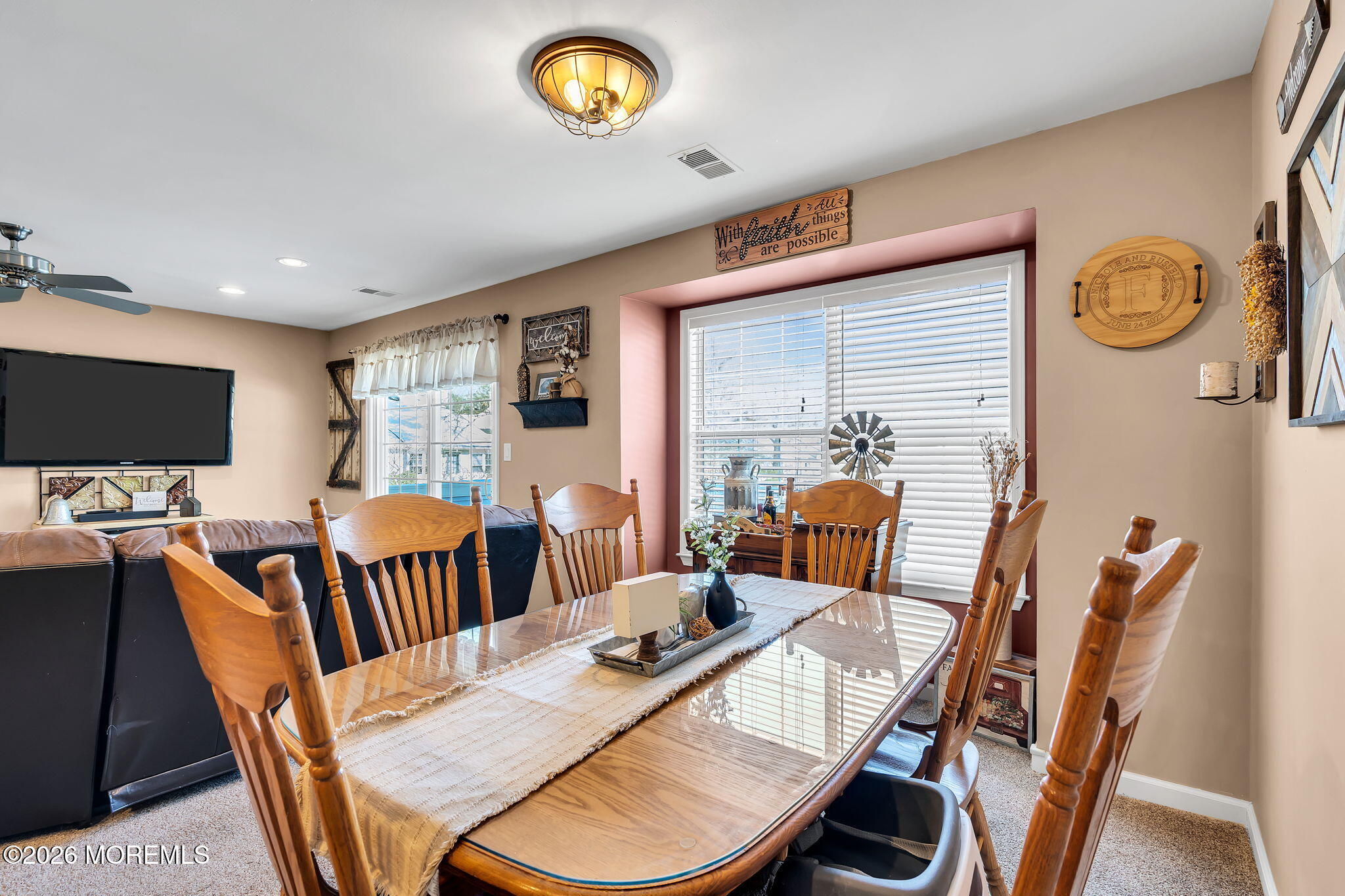 402 Brookview Court Howell, NJ 07731 - Photo 8 of 22 a view of a dining room with furniture window and wooden floor