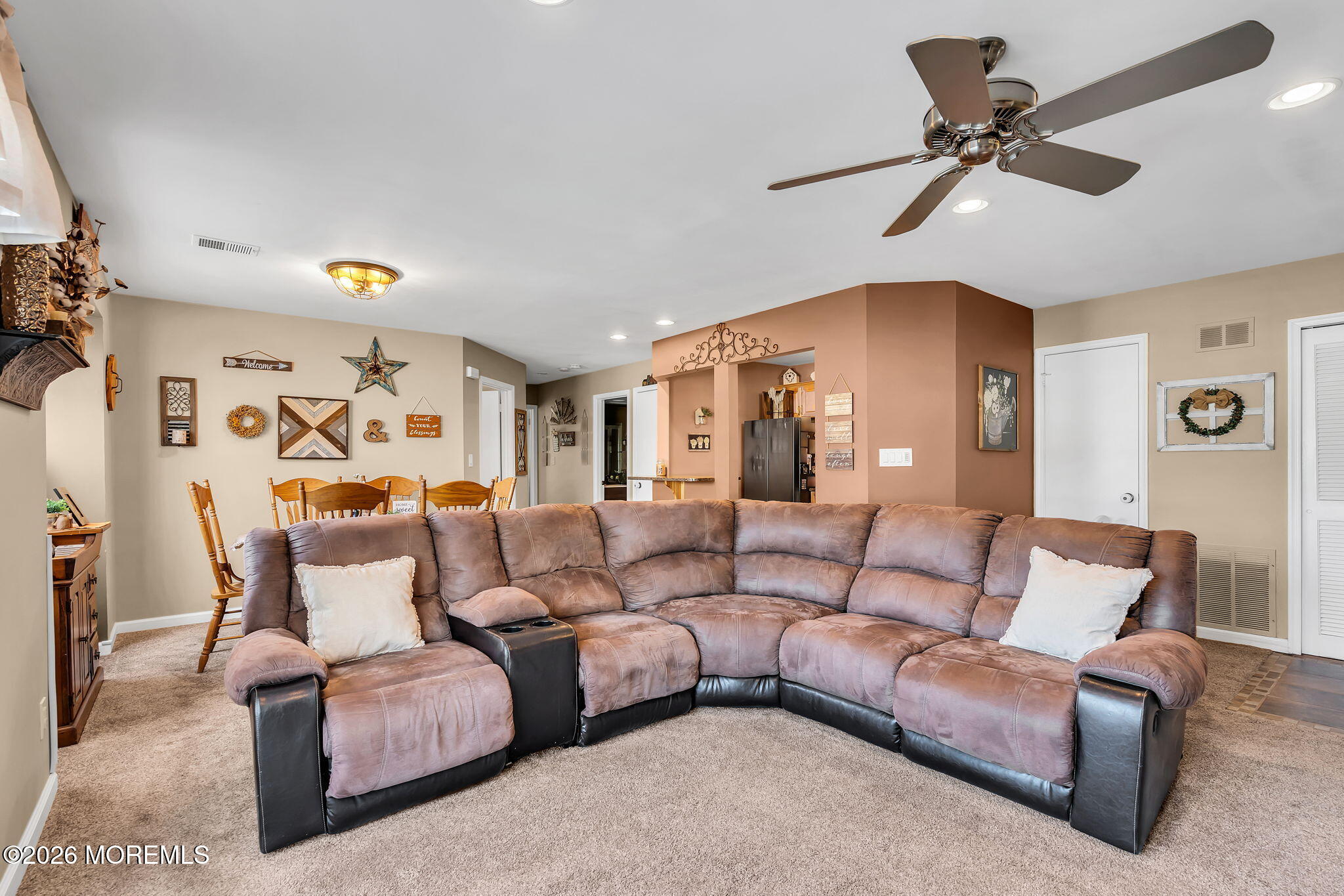 402 Brookview Court Howell, NJ 07731 - Photo 10 of 22 a living room with furniture and a ceiling fan