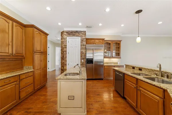 a view of a kitchen with a sink and a kitchen view