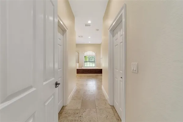 a large bathroom with a granite countertop double vanity sink mirror and