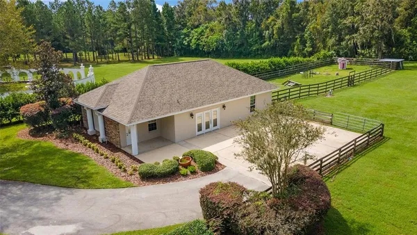 a living room with furniture water view and pool table