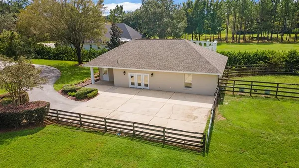 a view of a park with large trees