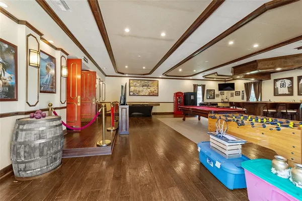 a view of a swimming pool with a slide and a tree