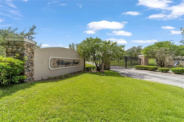 a view of a garden with a building in the background
