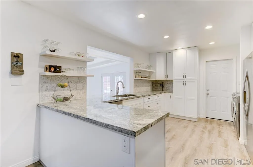 1985 La Cresta Road El Cajon, CA 92021 - Photo 11 of 25 a kitchen with a stove a sink a refrigerator and a cabinets