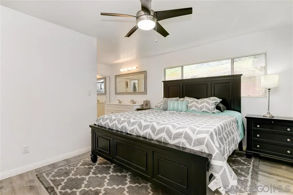 1985 La Cresta Road El Cajon, CA 92021 - Photo 16 of 25 a bedroom with a bed and wooden floor