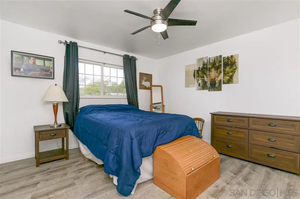 1985 La Cresta Road El Cajon, CA 92021 - Photo 17 of 25 a bedroom with a bed and a lamp on dresser