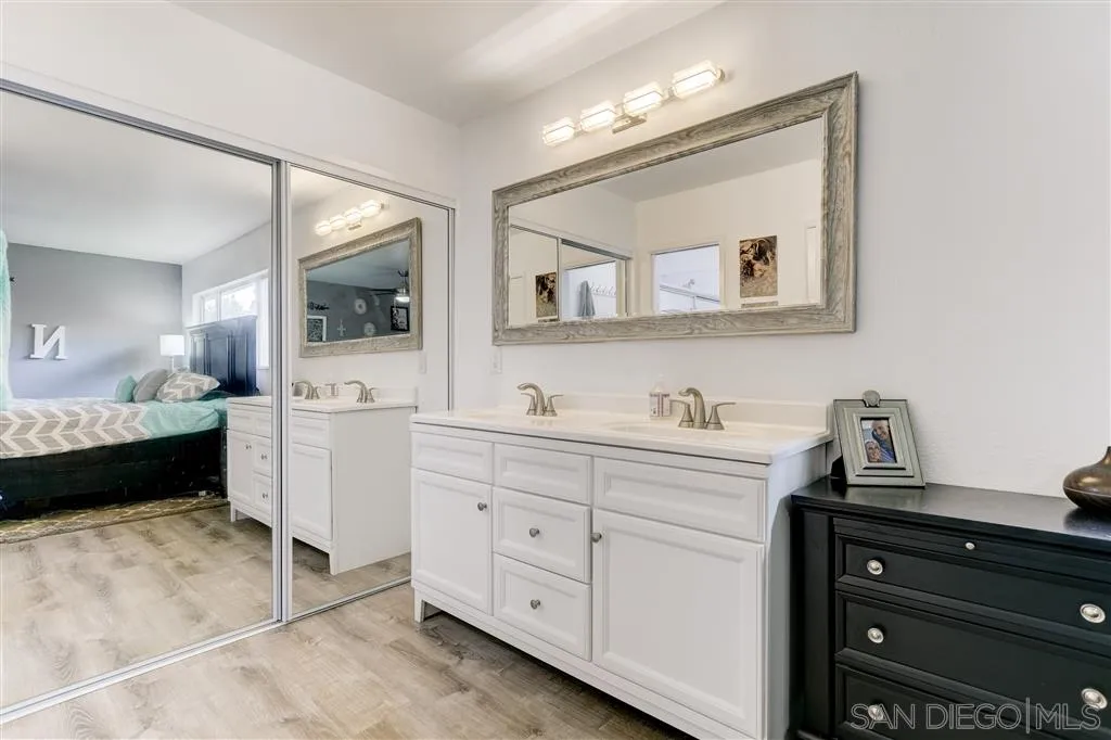 1985 La Cresta Road El Cajon, CA 92021 - Photo 19 of 25 a spacious bathroom with a double vanity sink and a mirror