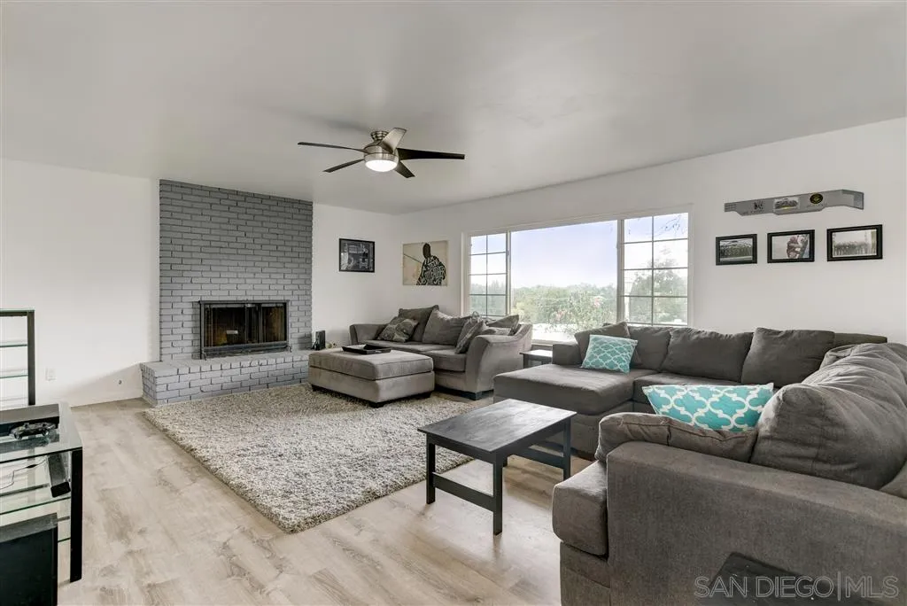 1985 La Cresta Road El Cajon, CA 92021 - Photo 7 of 25 a living room with furniture and a fireplace
