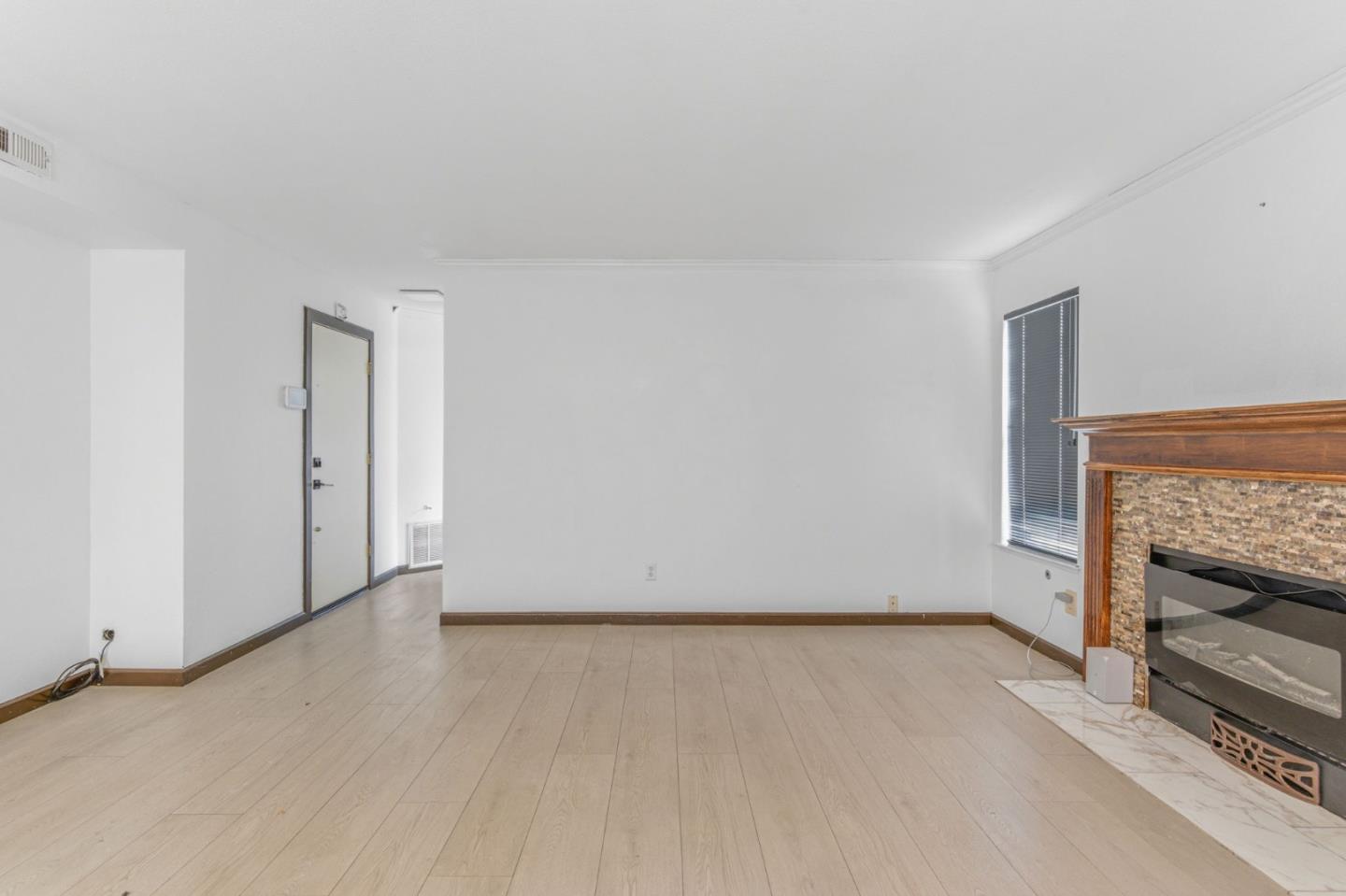 2678 Ramsdell Place San Jose, CA 95148 - Photo 17 of 41 an empty room with a fireplace