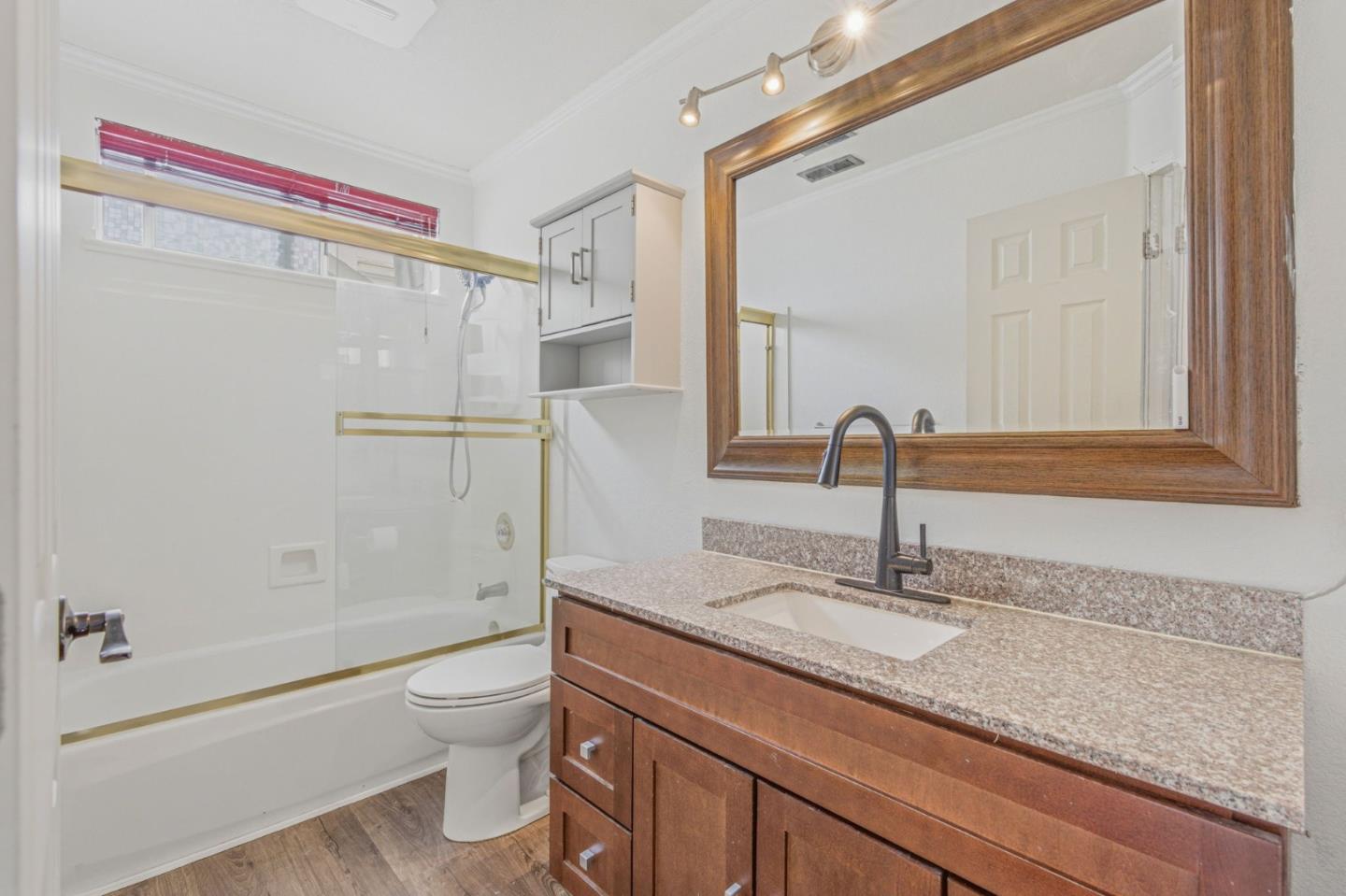 2678 Ramsdell Place San Jose, CA 95148 - Photo 25 of 41 a bathroom with a granite countertop sink a toilet and shower