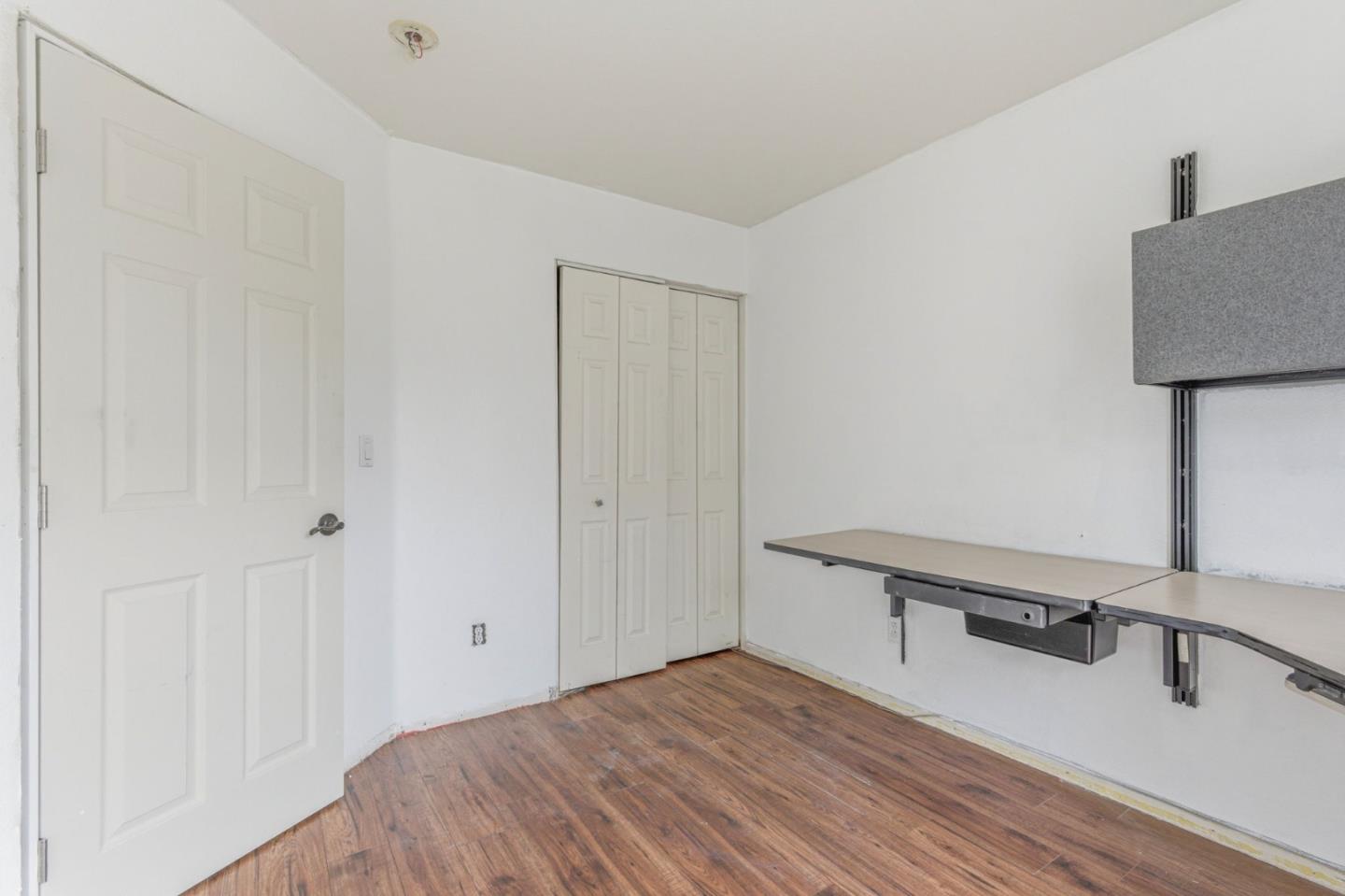 2678 Ramsdell Place San Jose, CA 95148 - Photo 27 of 41 a room with a bed and a wooden floor