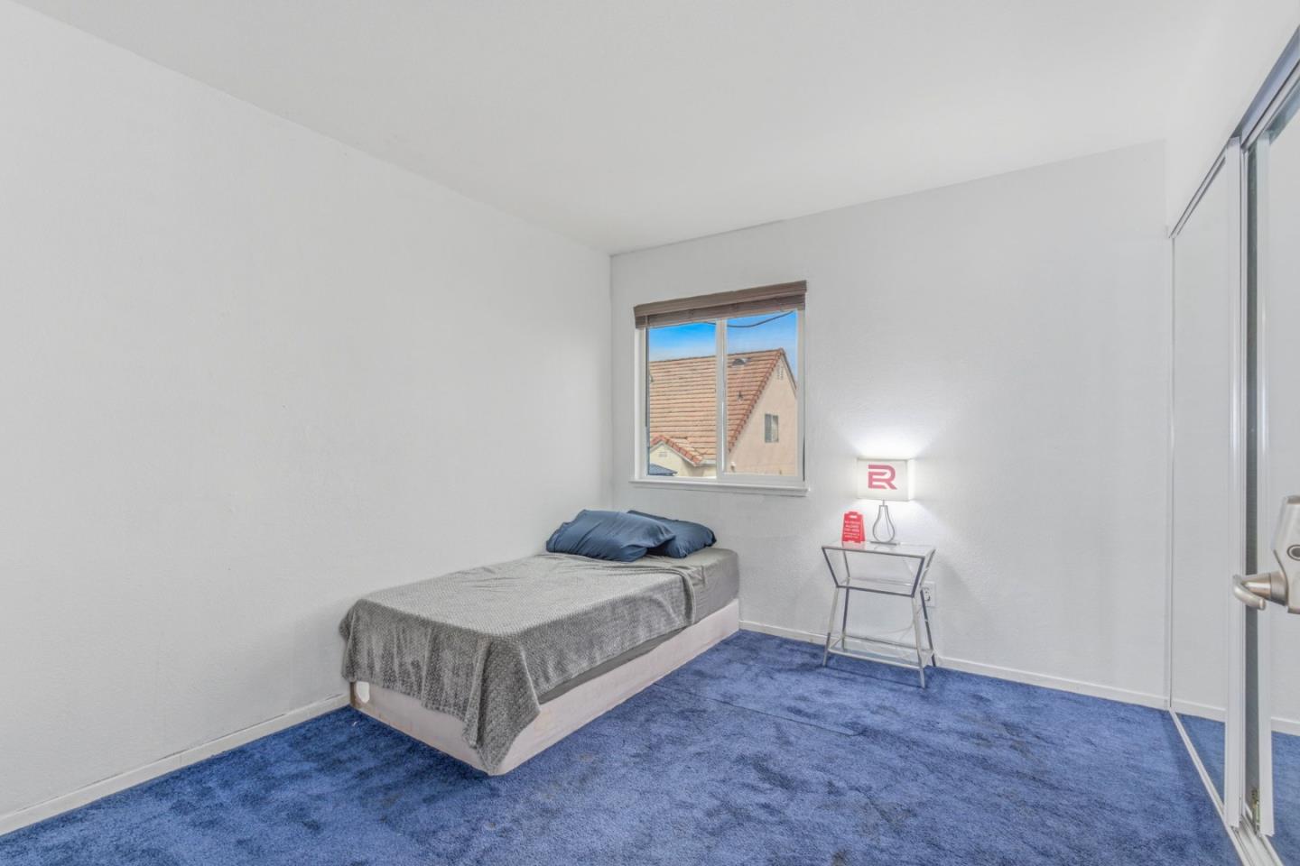 2678 Ramsdell Place San Jose, CA 95148 - Photo 30 of 41 a spacious bedroom with a bed and a window