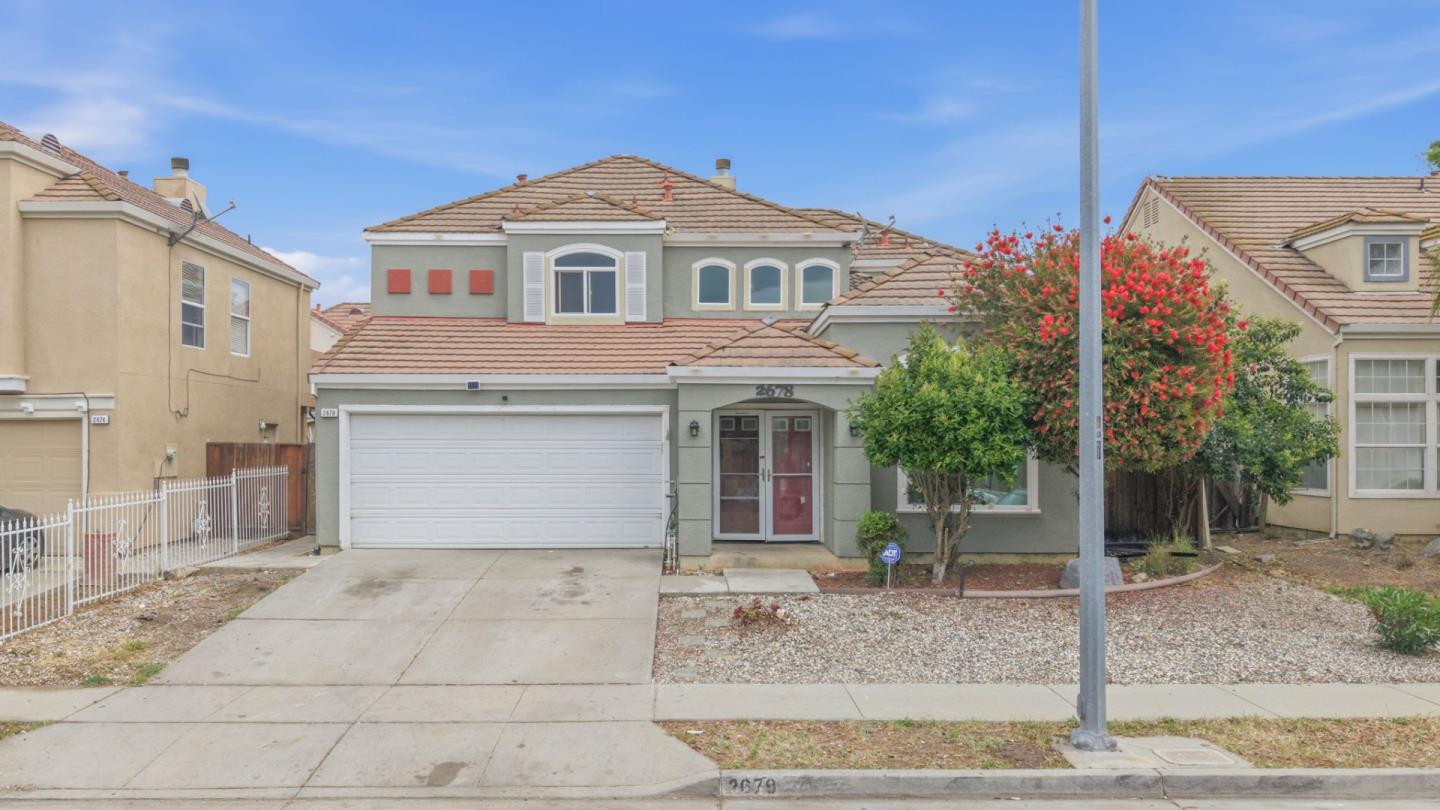 2678 Ramsdell Place San Jose, CA 95148 - Photo 3 of 41 a front view of a house with garage and parking