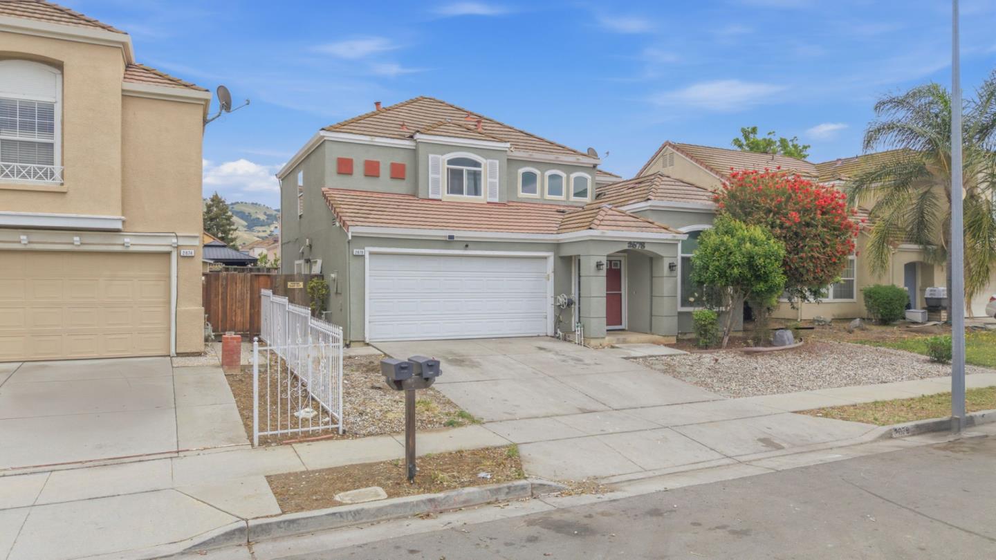 2678 Ramsdell Place San Jose, CA 95148 - Photo 4 of 41 a front view of a house with a yard