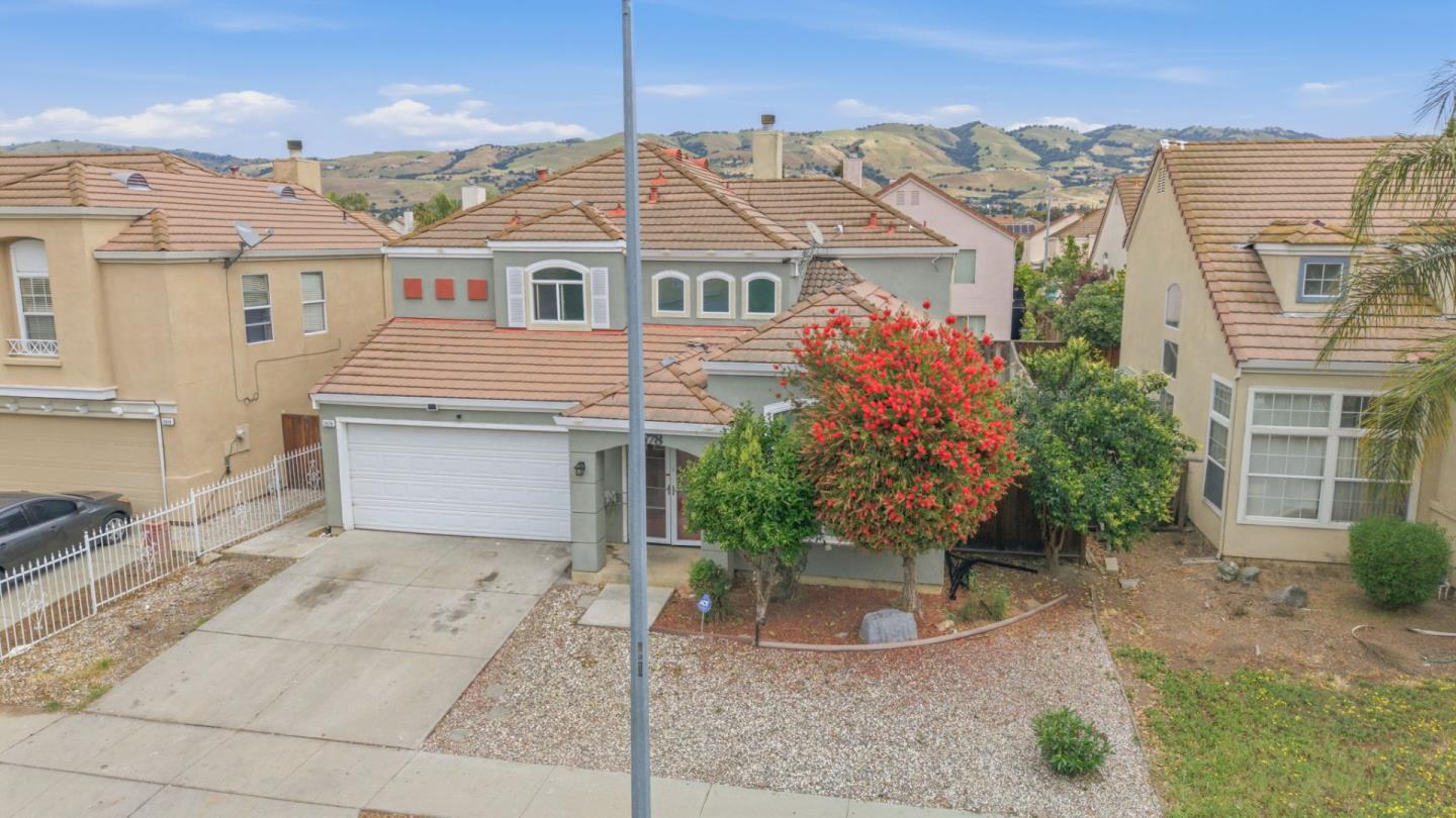 2678 Ramsdell Place San Jose, CA 95148 - Photo 5 of 41 a front view of a house with a garden