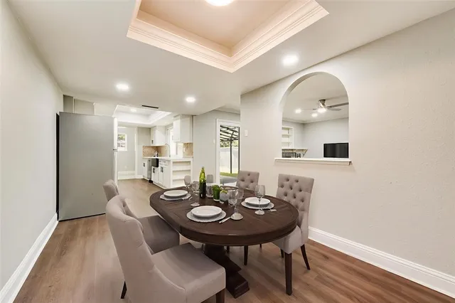 a view of a dining room with furniture and wooden floor