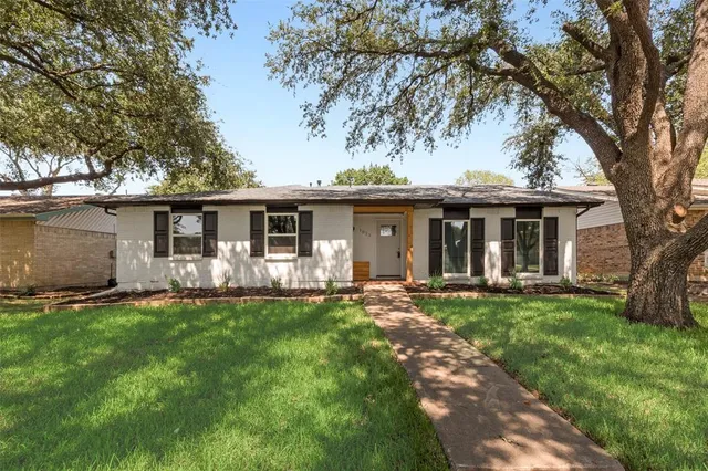 front view of a house with a garden