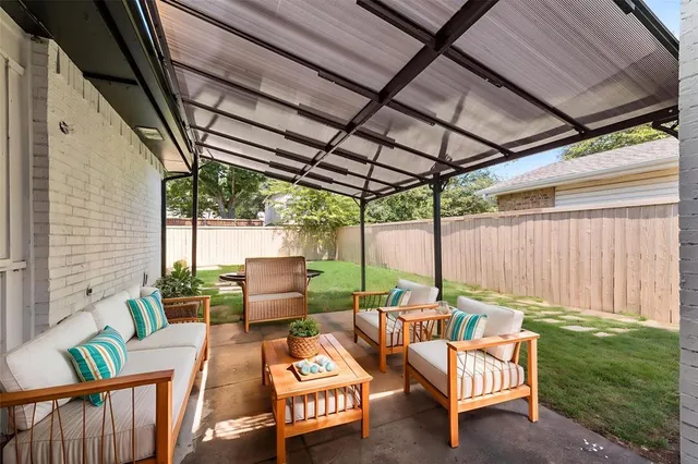a patio with patio outdoor seating and yard
