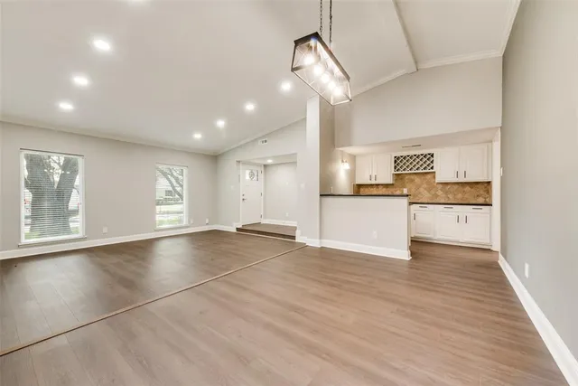 a view of a kitchen with a sink and cabinets