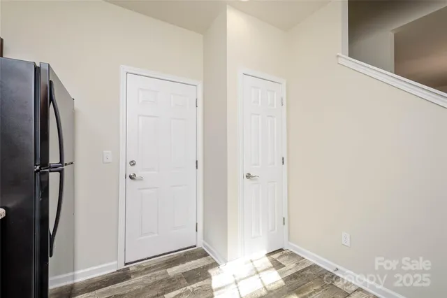 a kitchen with stainless steel appliances granite countertop a refrigerator stove a sink dishwasher and microwave oven