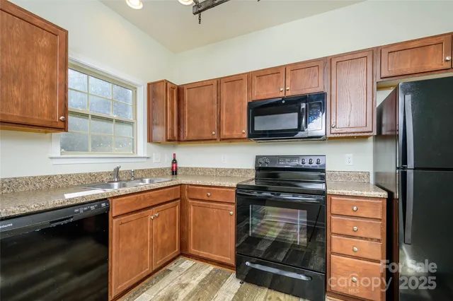 a view of bathroom with a shower and a door