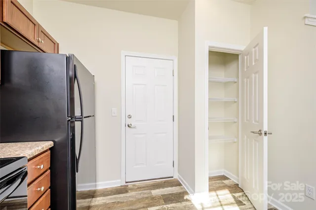 a view of storage and utility room with two washing machine
