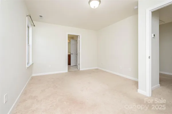 an empty room with a bathroom
