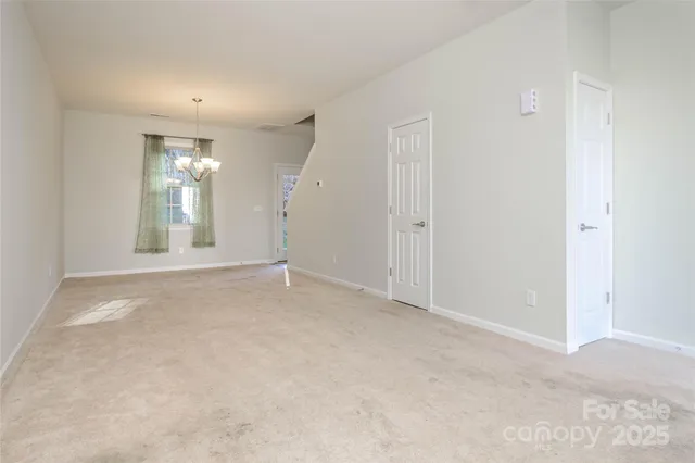 an empty room with windows and entrance