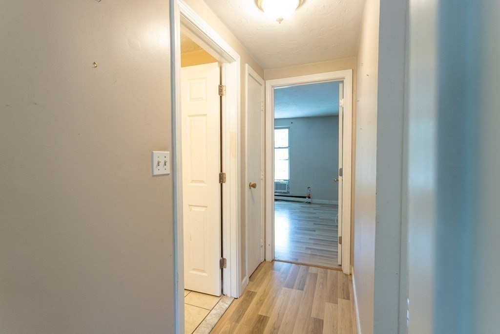 11 Tideview Path, Unit 17 Plymouth, MA 02360 - Photo 13 of 20 a view of a hallway with wooden floor