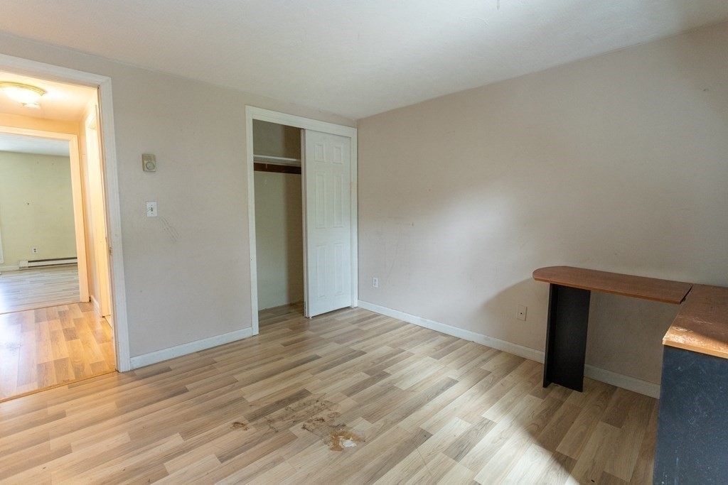 11 Tideview Path, Unit 17 Plymouth, MA 02360 - Photo 15 of 20 a view of an empty room with wooden floor
