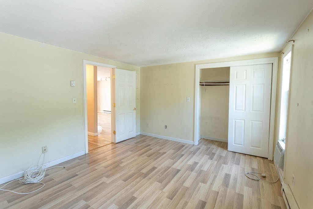 11 Tideview Path, Unit 17 Plymouth, MA 02360 - Photo 17 of 20 a view of an empty room and wooden floor