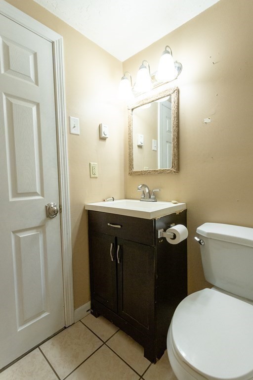 11 Tideview Path, Unit 17 Plymouth, MA 02360 - Photo 20 of 20 a bathroom with a sink vanity mirror and toilet