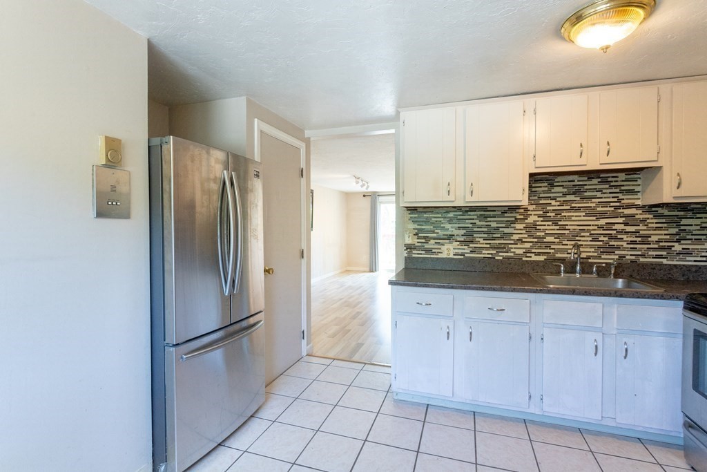 11 Tideview Path, Unit 17 Plymouth, MA 02360 - Photo 5 of 20 a kitchen with stainless steel appliances granite countertop a refrigerator and a sink