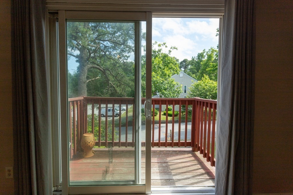 11 Tideview Path, Unit 17 Plymouth, MA 02360 - Photo 7 of 20 a view of a glass door with a porch