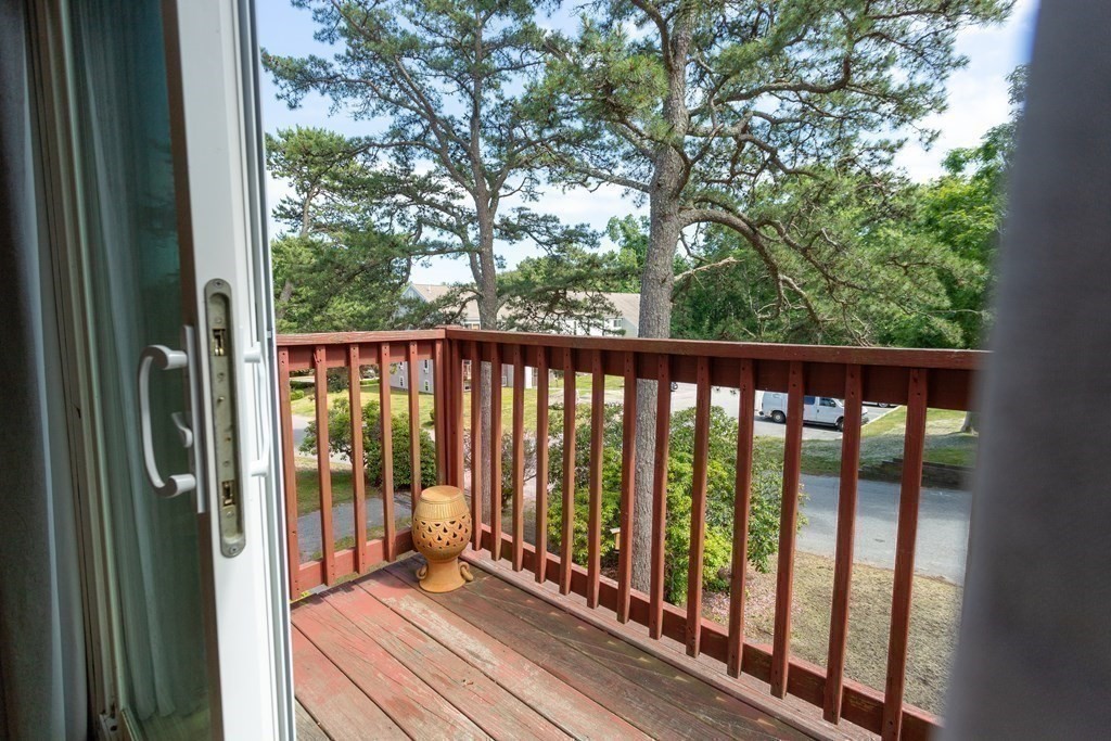 11 Tideview Path, Unit 17 Plymouth, MA 02360 - Photo 8 of 20 a view of a balcony with wooden floor