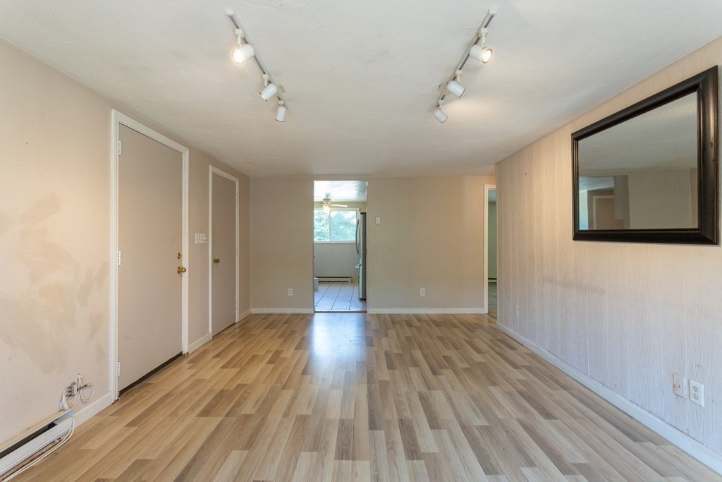11 Tideview Path, Unit 17 Plymouth, MA 02360 - Photo 10 of 20 wooden floor in an empty room with a window