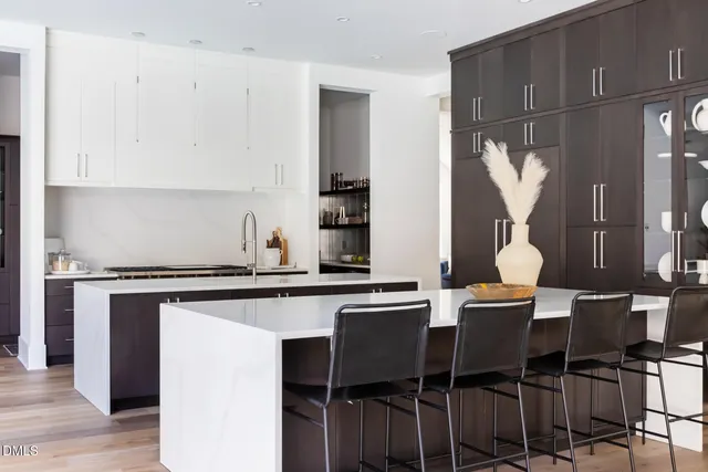 a kitchen with a sink and a white cabinets