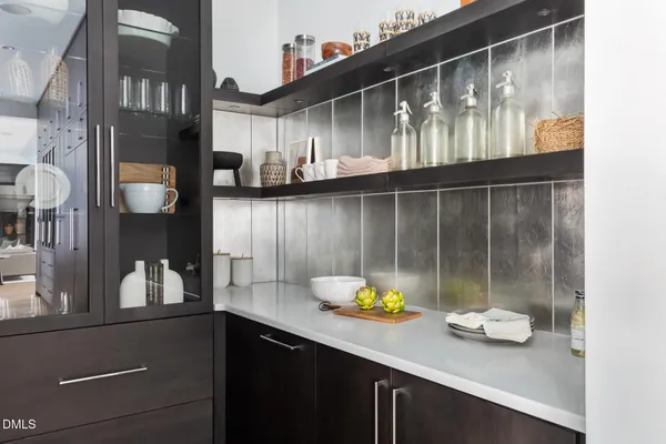 a kitchen with a sink appliances and cabinets