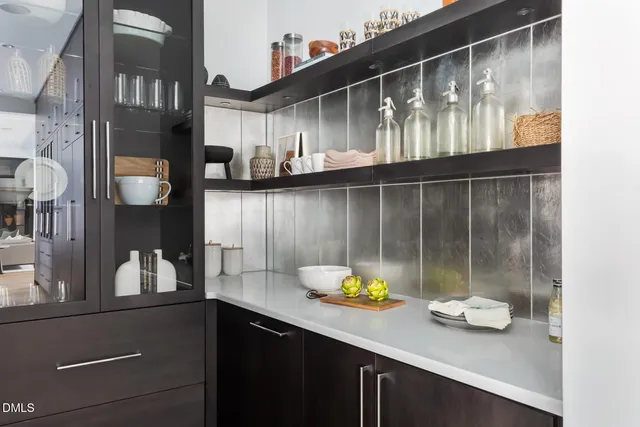 a kitchen with a sink appliances and cabinets