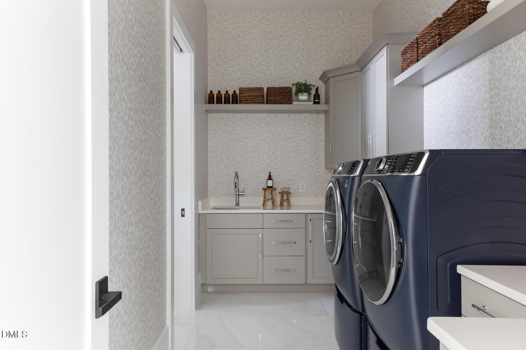 4300 Camelot Drive Raleigh, NC 27609 - Photo 47 of 71 a utility room with cabinets washer and dryer