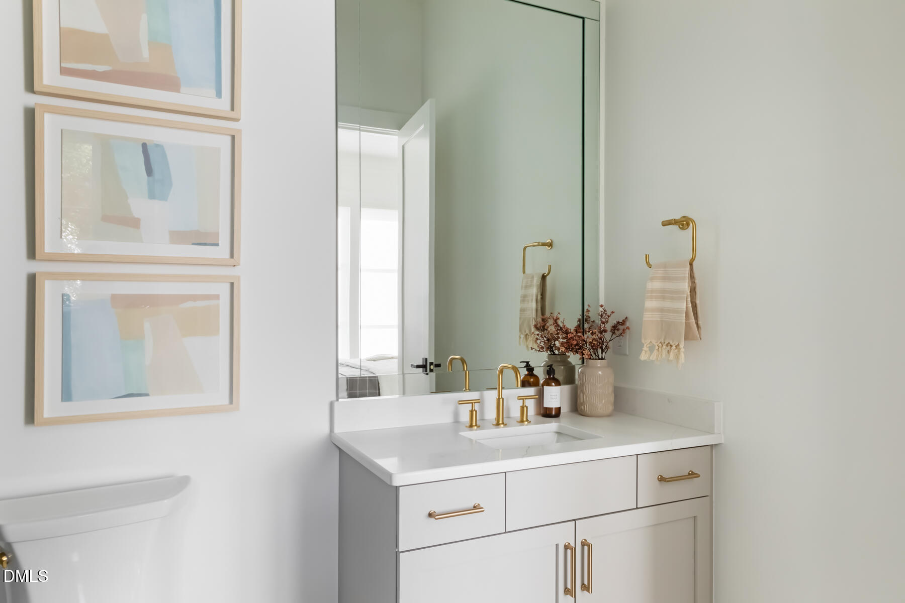 4300 Camelot Drive Raleigh, NC 27609 - Photo 51 of 71 a bathroom with a sink and a mirror