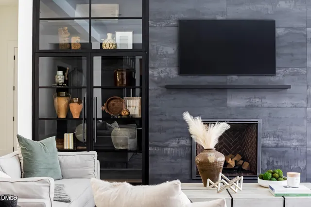 a kitchen with a table chairs and a refrigerator