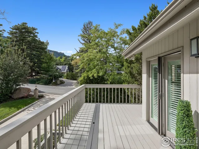 a bathroom with a granite countertop sink two mirror and a